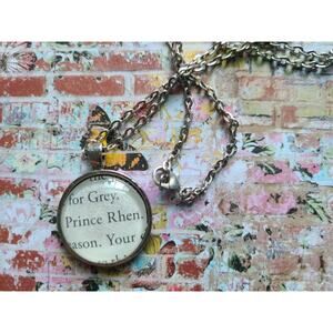 Prince Rhen pendant necklace made with A Curse So Dark and Lonely book pages